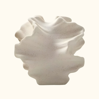 Contemporary floral vase japanese with undulating texture on clean white background