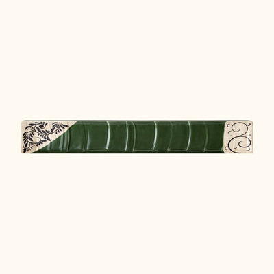 Japanese ceramic flower plate sushi with green leaf texture and traditional floral motifs on edges