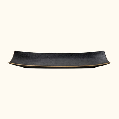 Elegant rectangular for black plate sushi in glossy ceramic finish on white background