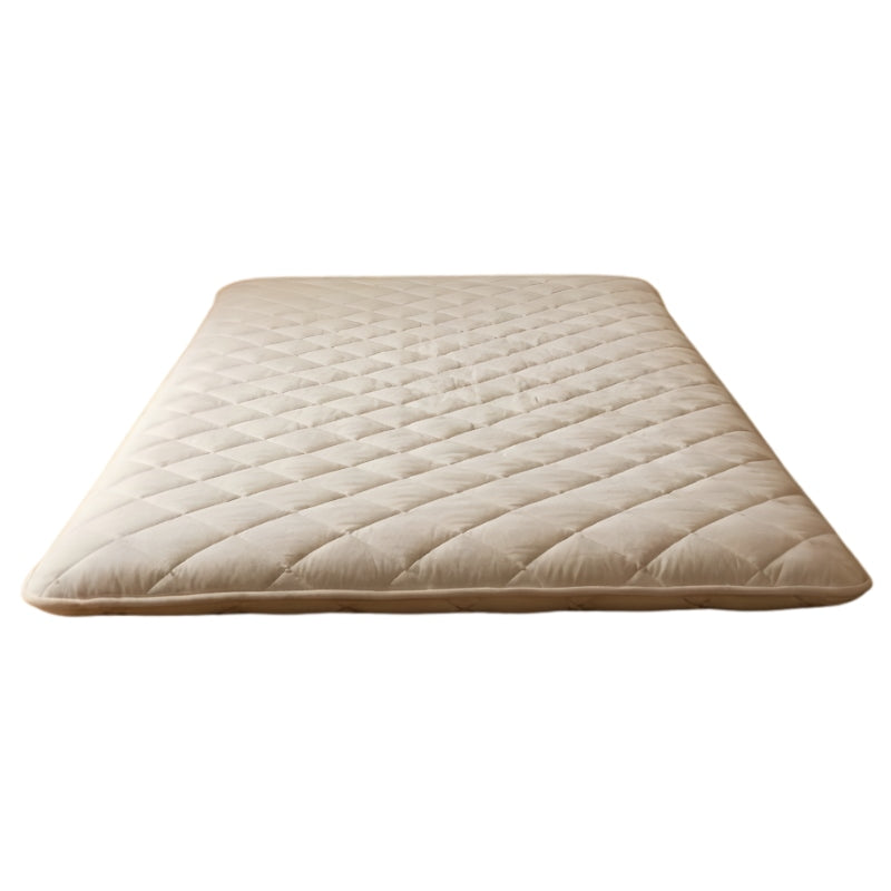 Beige futon floor japanese with horizontal quilted lines and wave pattern on neutral background