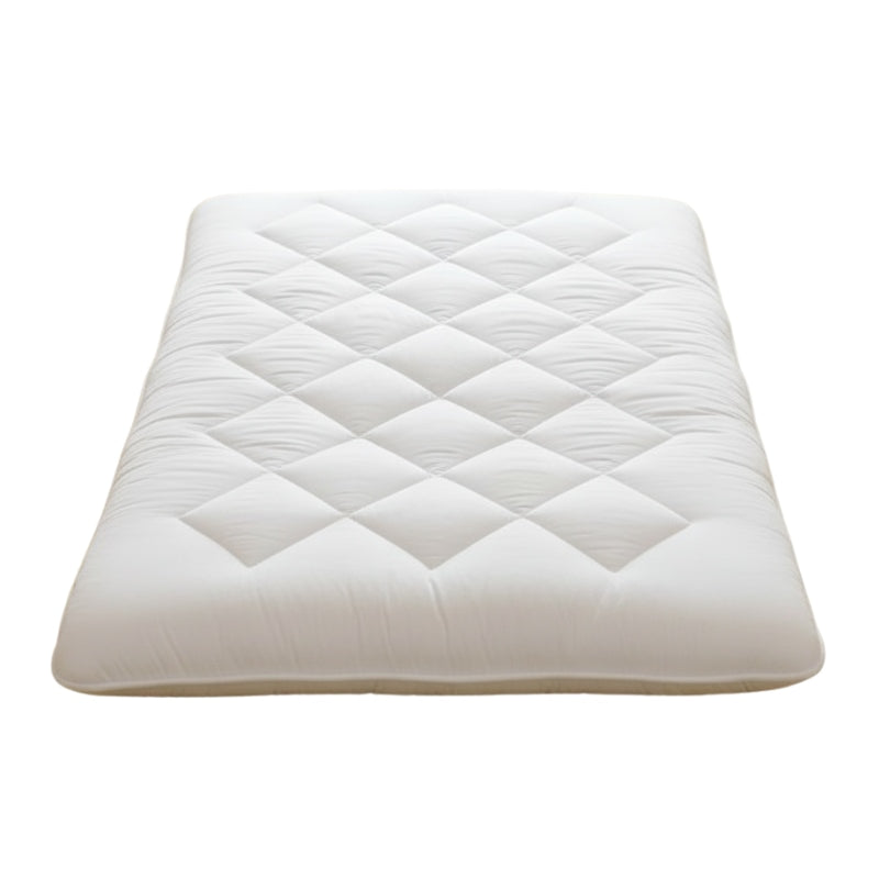 Thick white futon style japanese with wave quilting pattern and diamond stitching on clean neutral background