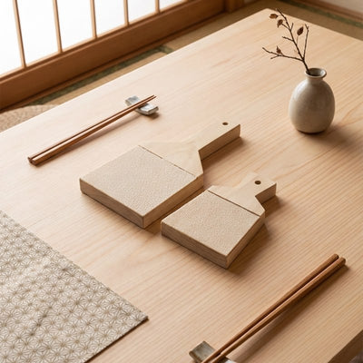 Premium grinder wasabi tools with chopsticks and ceramic vase on minimalist Japanese dining table