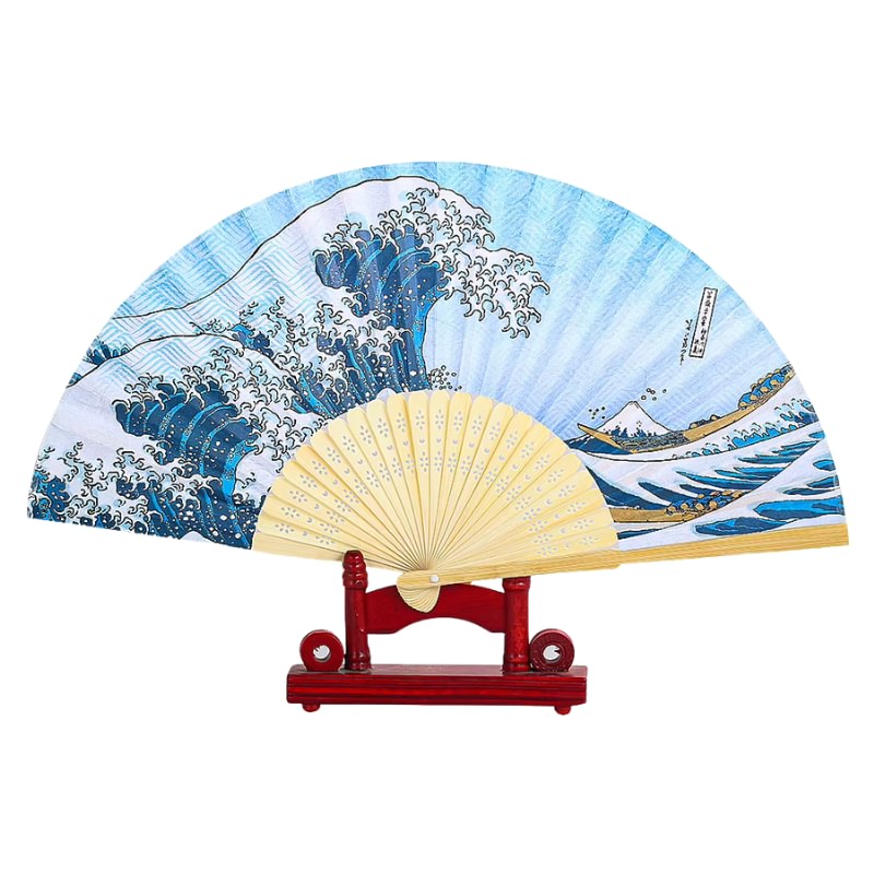 Traditional hand fan great wave displayed on red wooden stand showing famous Hokusai artwork with dramatic ocean waves and Mount Fuji