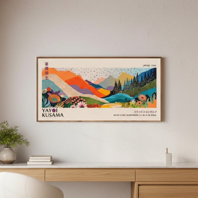Japanese art print canva featuring colorful layered mountains displayed above minimalist wooden console with ceramic vase and books