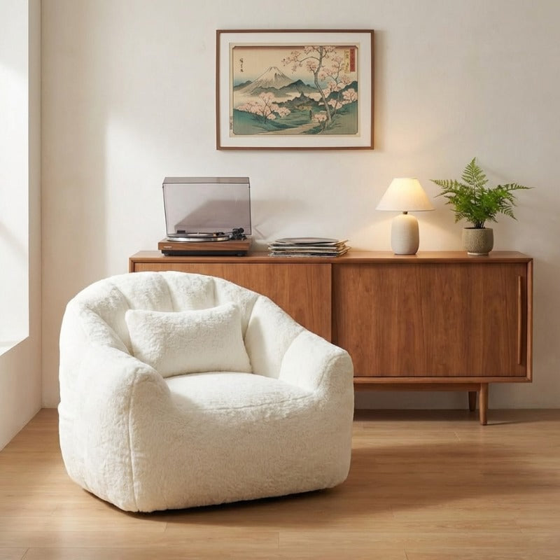 Japanese bag bean chair in white teddy fabric beneath Mount Fuji print and wooden credenza with turntable and ceramic lamp