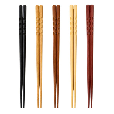 Set of 5 pairs of japanese bamboo chopsticks with carved dot grip in five colors : black, light bamboo, brown, cream and burgundy, displayed on white background