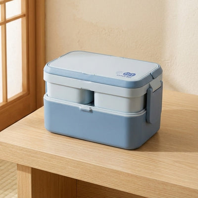 Compact japanese kids bento box kids in pastel blue with elastic band near bright window in minimalist Japanese style room