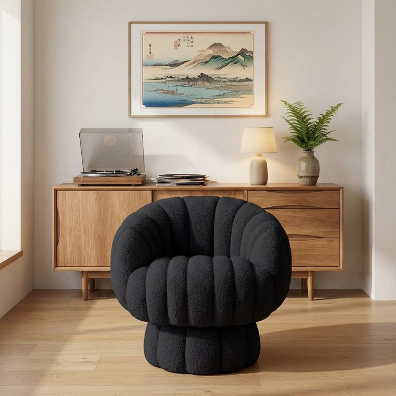Japanese floor sofa black with rounded bubble design beneath Mount Fuji vintage print and mid-century credenza with turntable
