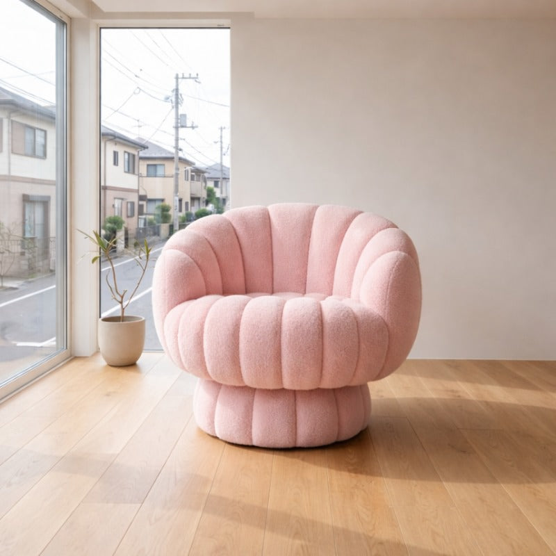 Plush japanese modern pink sofa with channel-tufted bouclé upholstery placed on light oak floor near large window overlooking quiet residential Japanese street