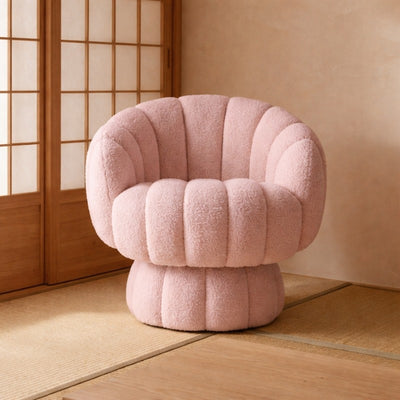 Soft japanese modern sofa in blush pink bouclé fabric sitting on tatami mat floor beside warm wooden shoji sliding doors in serene traditional interior