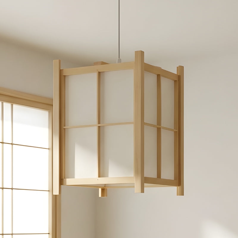 Large square japanese paper pendant light with classic grid pattern and natural wood frame near shoji screen