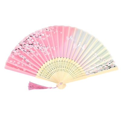 Elegant japanese pink hand fan with cherry blossom pattern gradient colors and natural bamboo frame with pink tassel on clean white background