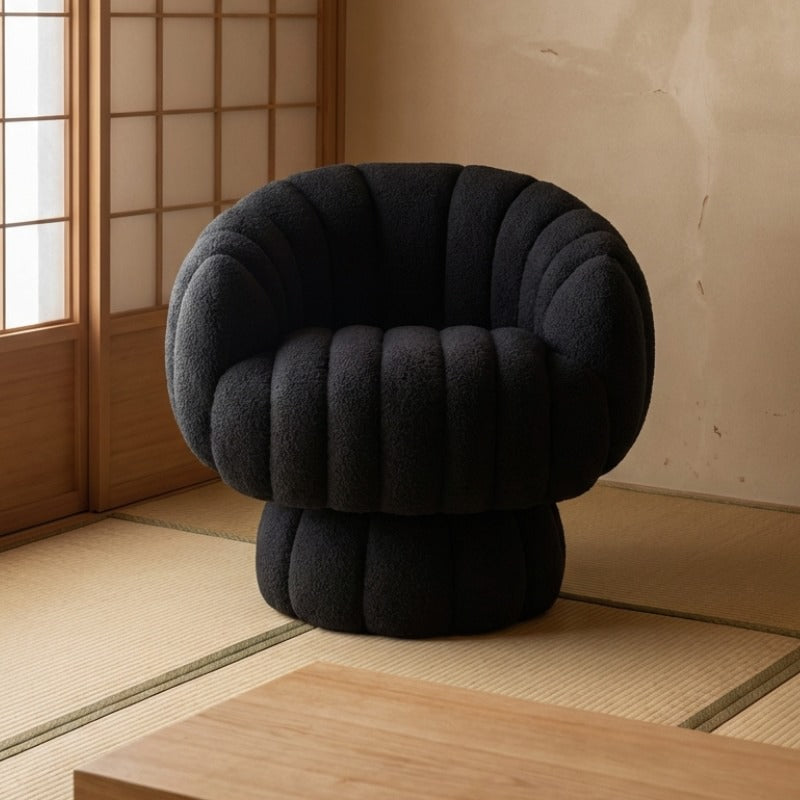 Japanese sofa floor with black bubble upholstery on tatami near shoji screen and low wooden table in traditional setting