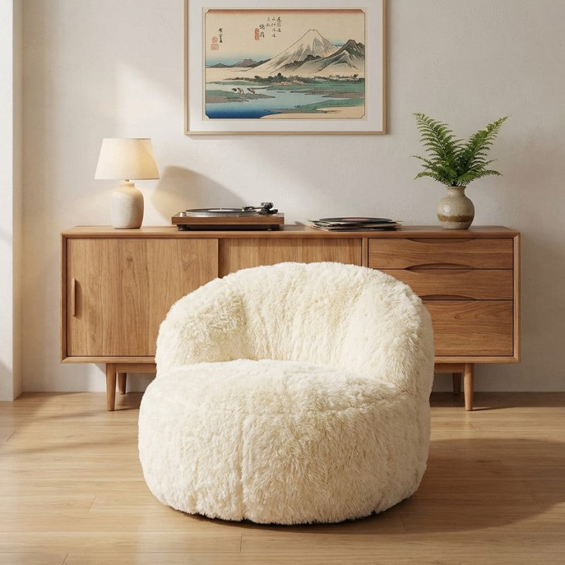 Japanese sofa low armchair with cream sherpa upholstery beneath Mount Fuji print and wooden credenza with turntable and fern