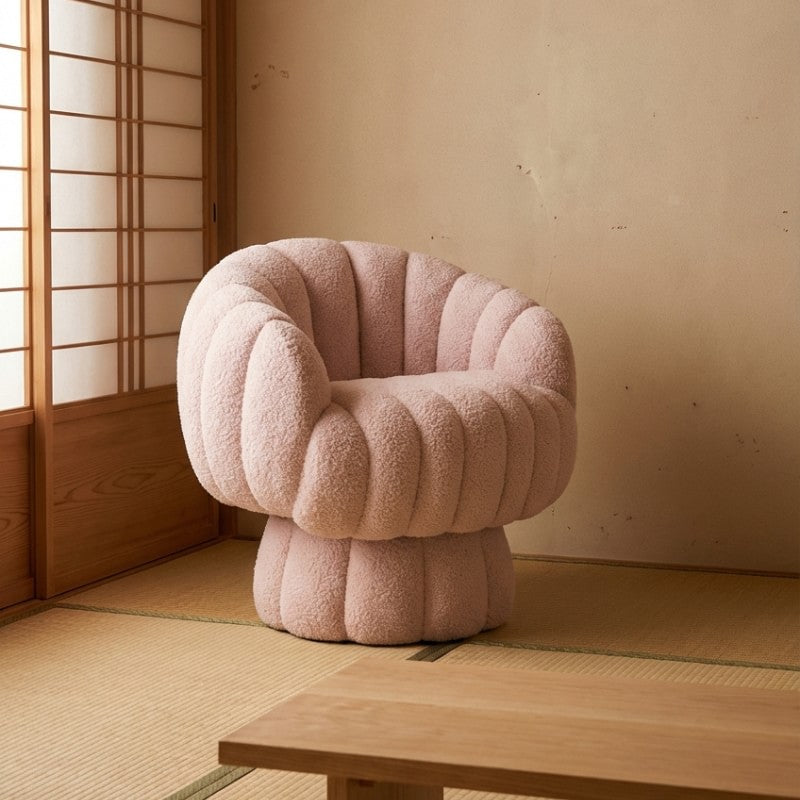 Japanese modern pink sofa chair in bouclé fabric with channel tufting on a tatami floor next to a shoji door and a low wooden table