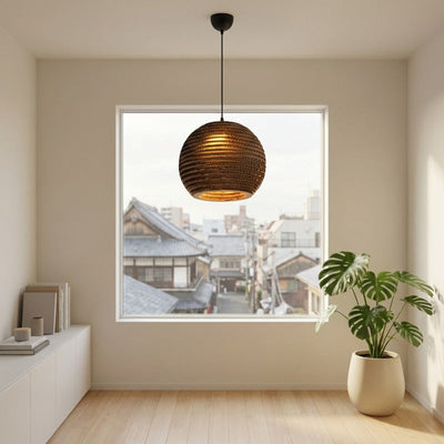 Japanese style pendant light paper round corrugated cardboard lampshade illuminated in minimalist white interior with urban backdrop
