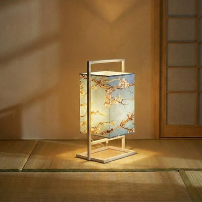 Beautiful japanese style table lamp featuring golden sakura blossoms on blue gradient shade illuminating authentic tatami interior with warm ambient light