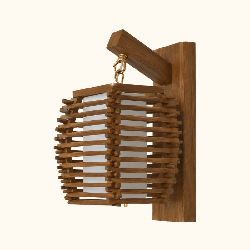 Side view of a japanese wall lamp wood construction, showing the woven slat shade suspended from a brass chain link beneath an angled wooden wall bracket