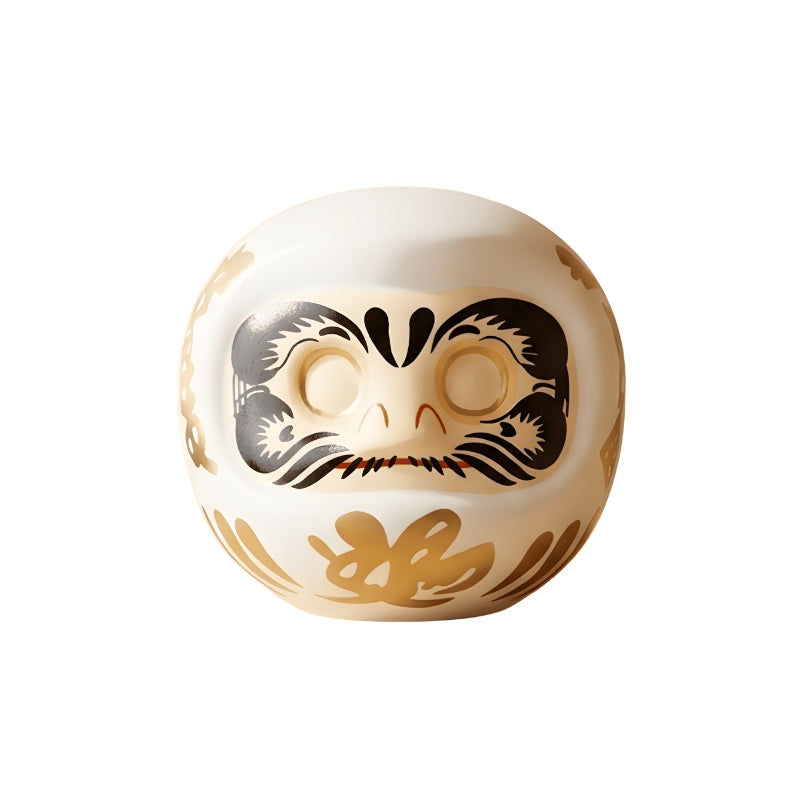 Japanese white daruma doll with golden calligraphy and blank eyes for wish making tradition