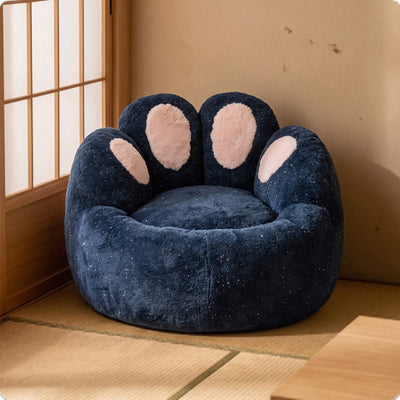 Cozy navy blue kids bean bag chair with plush paw-shaped backrest and pink details beside a traditional Japanese shoji screen.