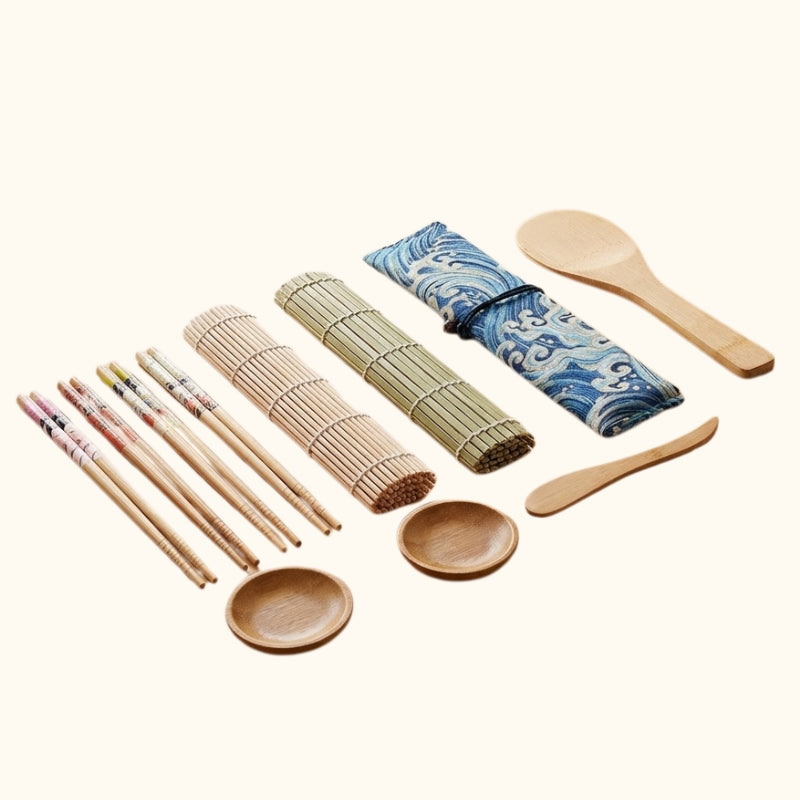 Authentic kit sushi make with blue wave fabric pouch, bamboo mats and wooden utensils on white background