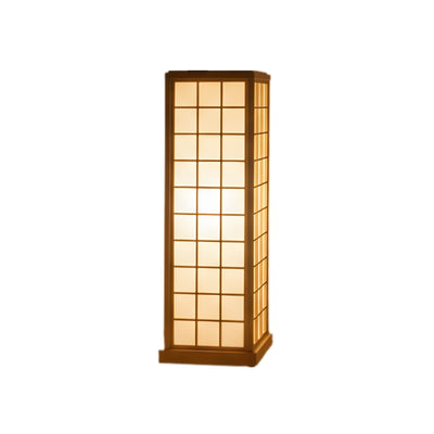 Kumiko japanese lamp illuminated showing pinewood frame and paper panels on clean neutral background