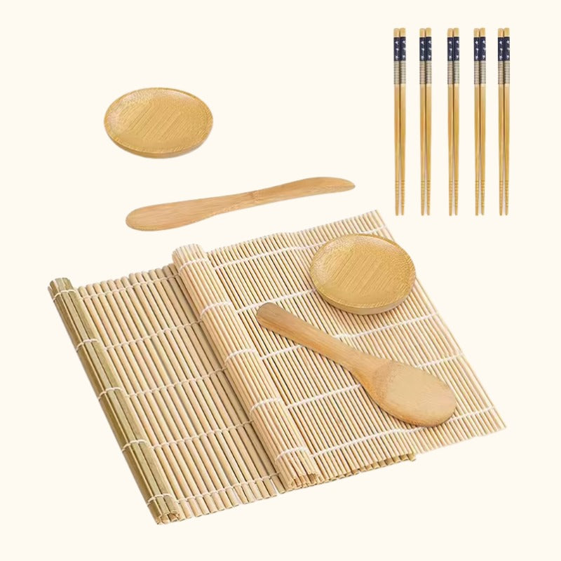 Professional making kit for sushi including bamboo mat, wooden paddles, sauce dishes and decorative chopsticks