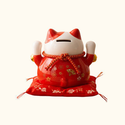 Red Maneki Neko Statue Japanese ceramic money box, rear view with raised paws and floral decorations