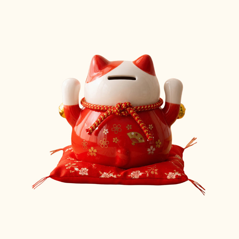Red Maneki Neko Statue Japanese ceramic money box, rear view with raised paws and floral decorations