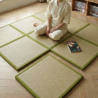 Mat japanese floor tiles with person in white clothing sitting seiza position near bookshelf with manga collection