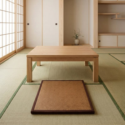 Mat japanese in brown rattan weave under low wooden table on tatami flooring with shoji screen fusuma and tokonoma niche