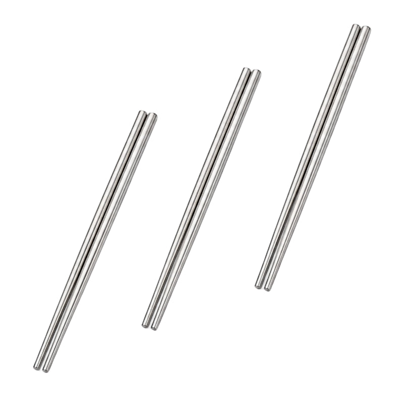 Three pairs of polished metal chopsticks arranged at varying lengths on a clean white background