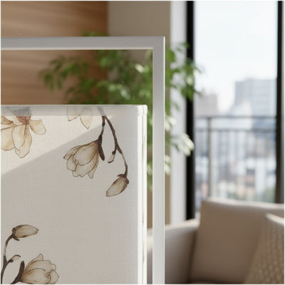 Close up detail of modern table lamp japanese featuring watercolor beige blossoms on white fabric shade with minimalist metal frame construction