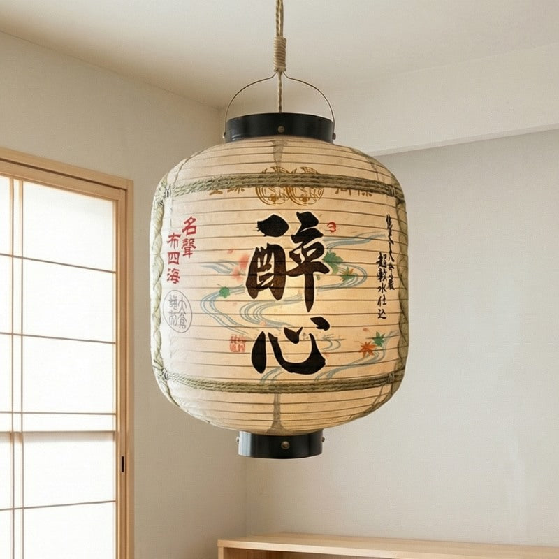 Elegant outdoor japanese lantern featuring river wave patterns and traditional calligraphy suspended near shoji window in minimalist contemporary interior with natural daylight