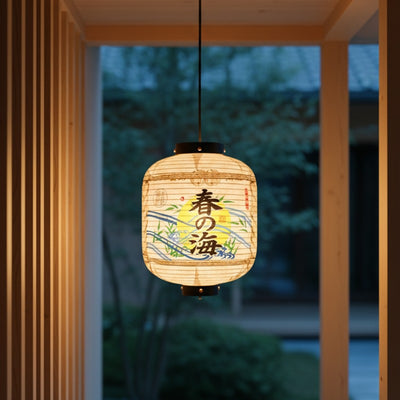 Glowing paper japanese lantern kanji with spring sea kanji and wave patterns hanging in modern wooden interior with garden views at dusk