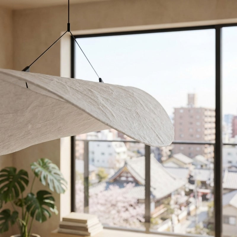 Close up of pendant lamp japandi showcasing natural wood grain and organic flowing shape against window