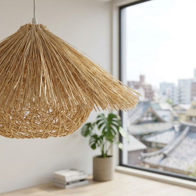 Pendant light Japanese rattan close-up showing detailed weaving near bright window with monstera plant and urban view