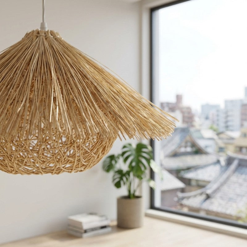Pendant light Japanese rattan close-up showing detailed weaving near bright window with monstera plant and urban view