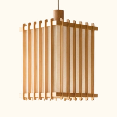Close up of cylindrical pendant light japanese style shoji with warm glow and natural wood slats