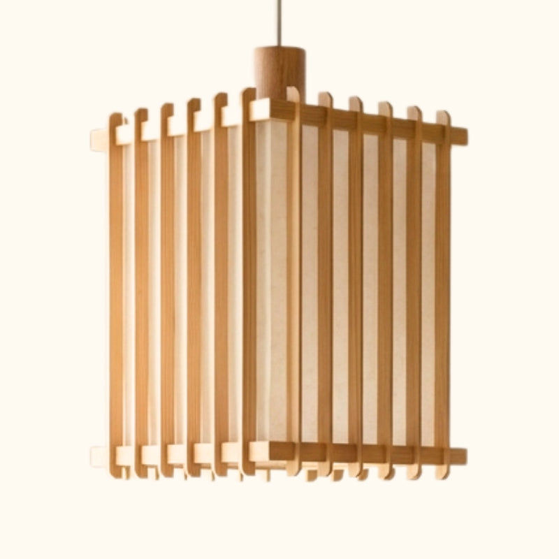 Close up of cylindrical pendant light japanese style shoji with warm glow and natural wood slats