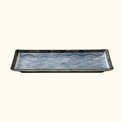 Premium plate sushi fancy with handpainted blue wave motifs and black ceramic frame on white background