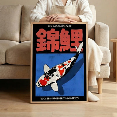 Print carp koi Nishikigoi framed poster held by woman in front of beige sofa in modern living room