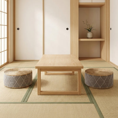 Seat cushion japanese pair with grey geometric patterns around wooden table on tatami mats with fusuma doors and tokonoma