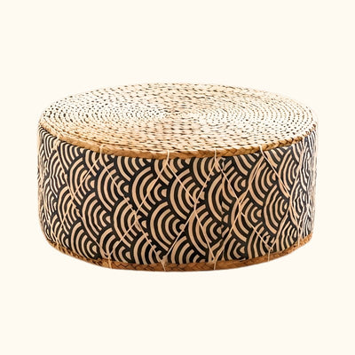 Seat floor japanese round cushion with natural woven top and black seigaiha wave pattern on white background