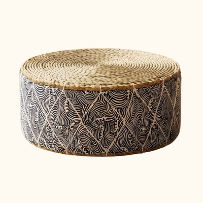 Seating japanese floor round cushion with handwoven rattan top and traditional seigaiha wave motifs on neutral background