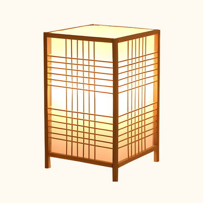 Authentic shoji lamp wood with square lattice frame and warm amber light on white background