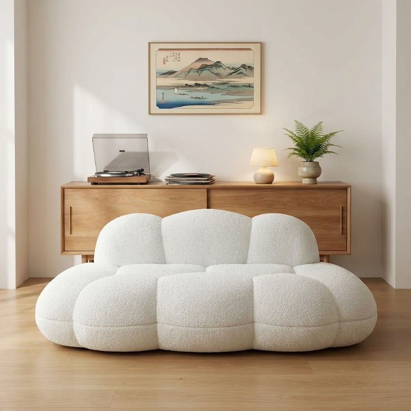 Sofa japanese with white bubble modules beneath Mount Fuji vintage print and mid-century wooden credenza with turntable