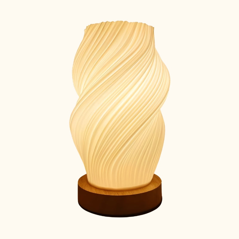 Minimalist spiral japanese lamp table featuring organic twisted white shade on round natural wood base