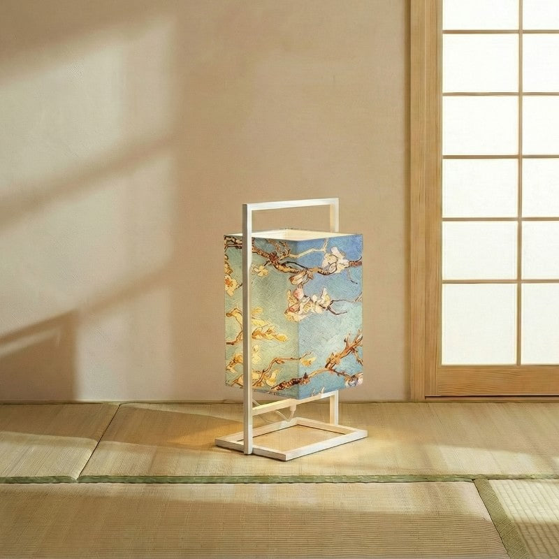 Traditional style japanese table lamp with golden cherry blossoms on gradient blue shade illuminating tatami floor near bright shoji screen