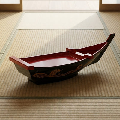 Sushi floating boat glossy black with red interior on traditional tatami mat floor near shoji sliding doors